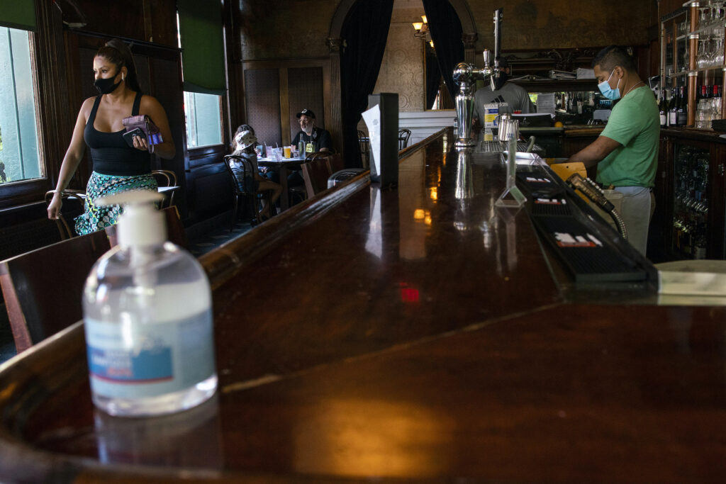 Virus Outbreak New Jersey Restaurants People have lunch inside a local restaurant on Friday, Sept. 4, 2020, in Hoboken, New Jersey. (AP Photo/Eduardo Munoz Alvarez)