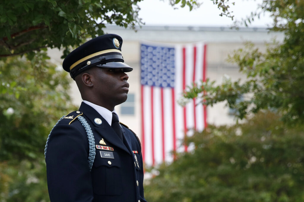 Sept 11 Anniversary In this Sept. 11, 2019 file photo, a member of the U.S. Army Old Guard stands on the grounds of the National 9/11 Pentagon Memorial before a ceremony in observance of the 18th anniversary of the September 11th attacks at the Pentagon in Washington. (AP Photo/Patrick Semansky)