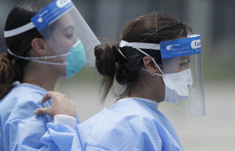 Healthcare workers at a COVID-19 testing site