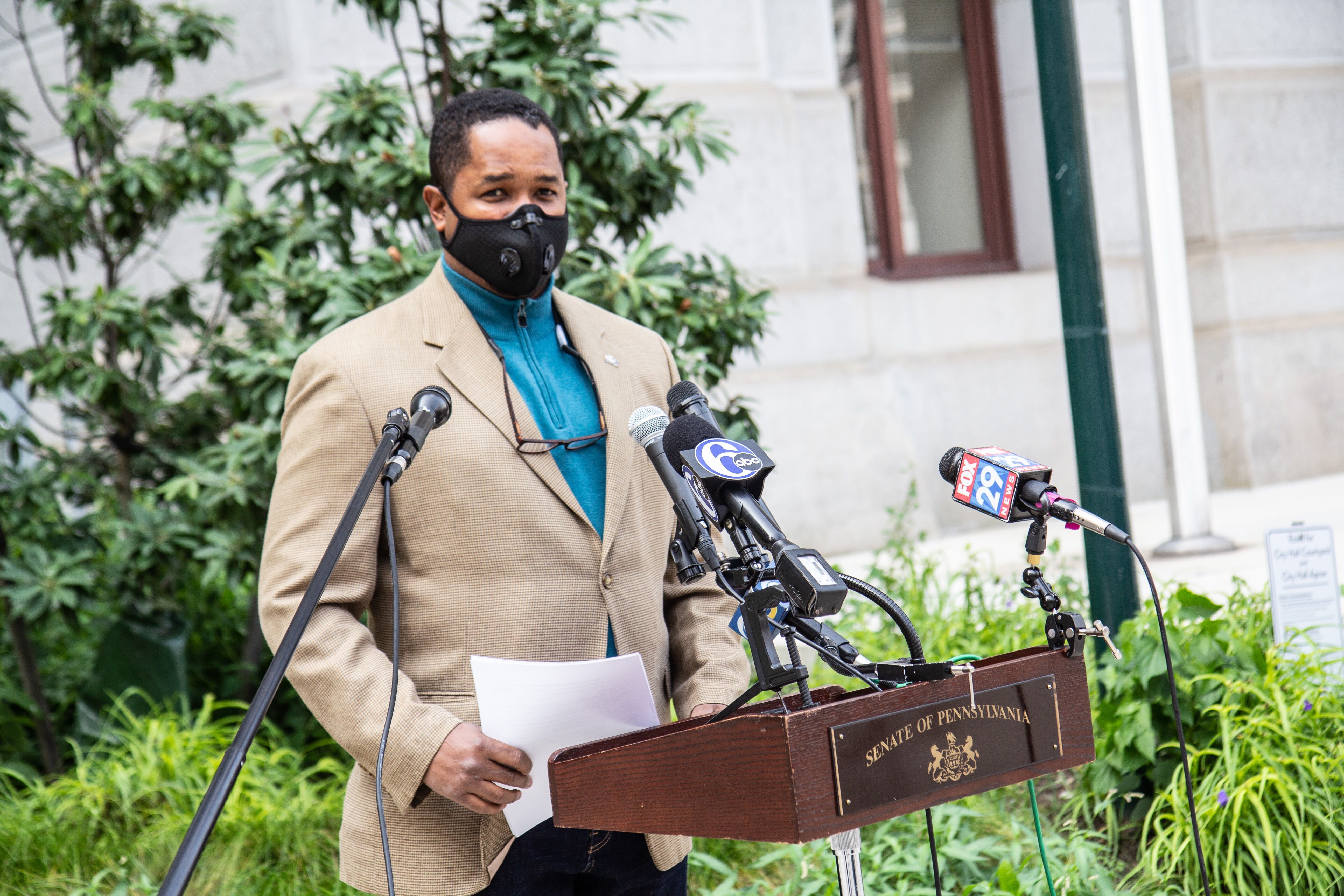 Pennsylvania State Sen. Sharif Street speaks from behind a podium