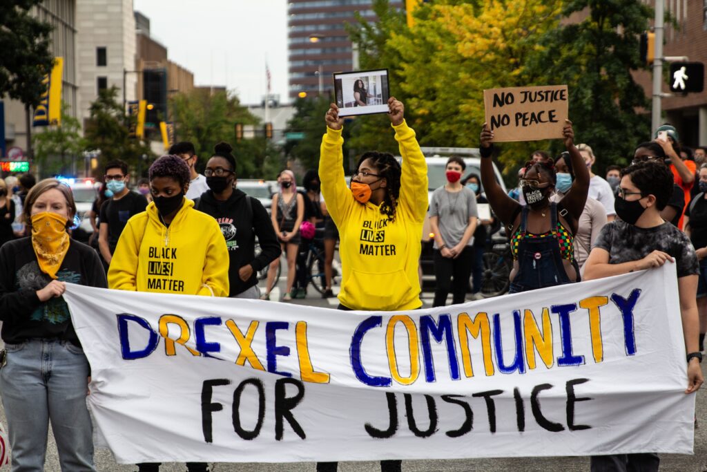Image from iOS (166) Protesters march up 33rd Street in Philadelphia’s University City chanting “Justice for Breonna Taylor.” (Kimberly Paynter/WHYY)