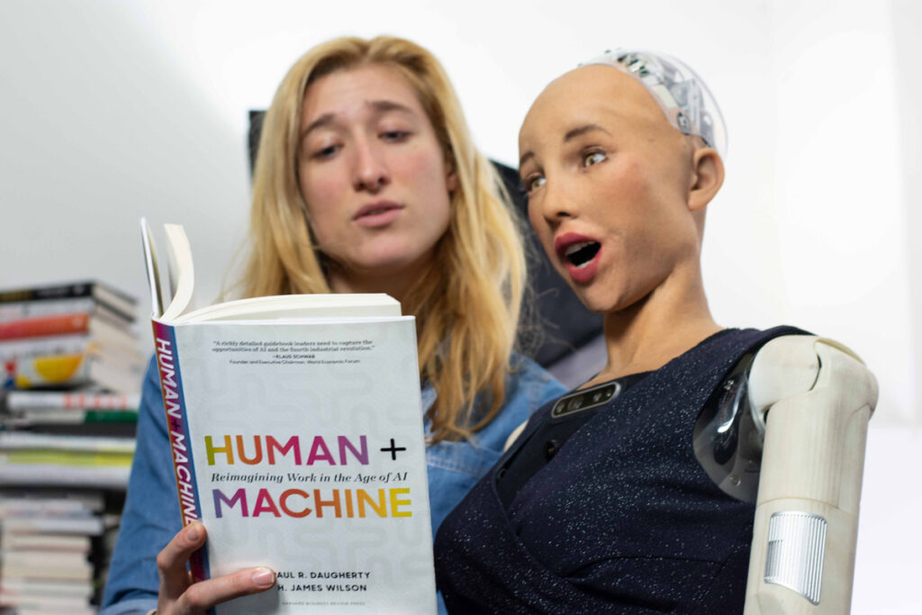 Sarah Rose Siskind with Sophia 1200 Sarah Rose Siskind reads a book to Sophia the Robot, an interviewer, guest speaker and host with over 16,000 YouTube subscribers. (Image courtesy of Nikki Thomas)