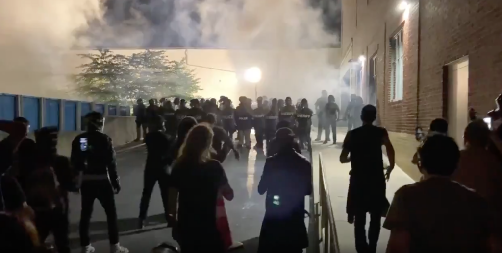 Tear-Gas-Lancaster-Police-Shooting Lancaster police deployed tear gas on a crowd of people protesting early Monday after an officer shot and killed a man while responding to a domestic disturbance call.