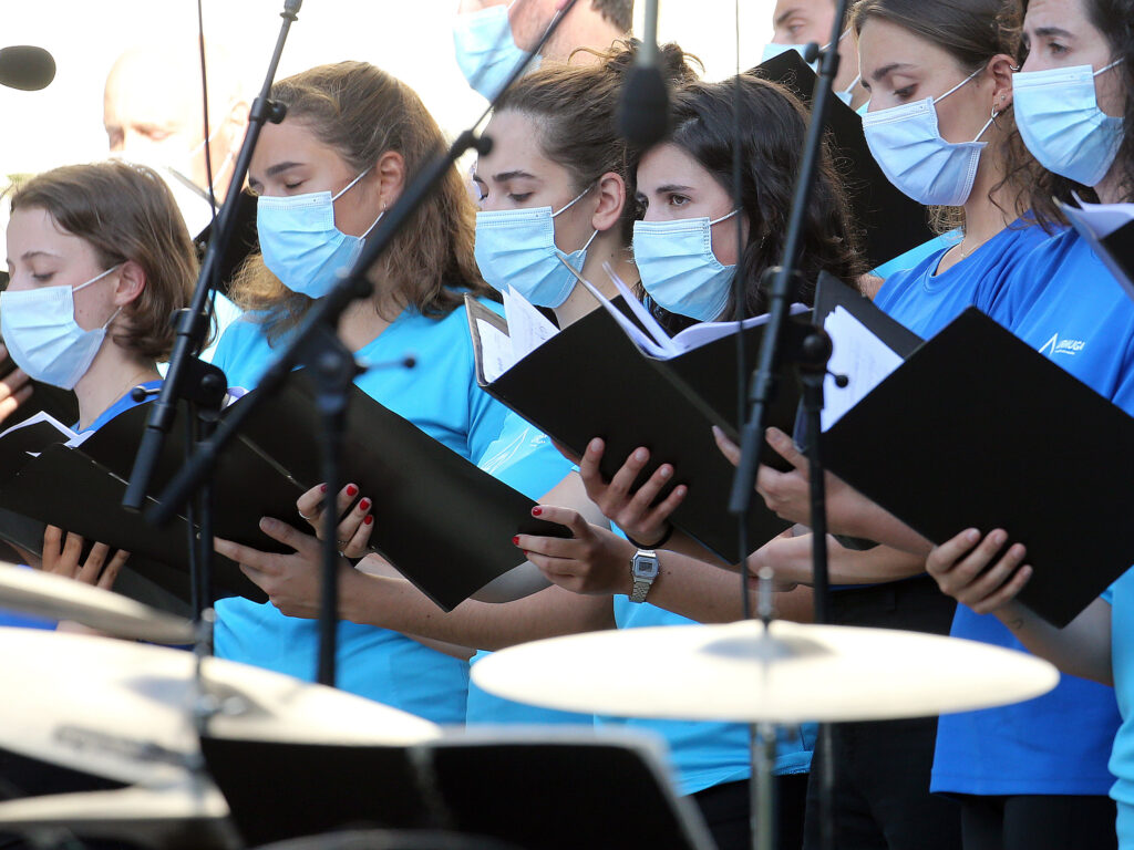 The Centers for Disease Control and Prevention briefly posted new guidance to its website stating that the coronavirus can commonly be transmitted through aerosol particles, which can be produced by activities like singing. Here, choristers wear face masks during a music festival in southwestern France in July. The Centers for Disease Control and Prevention briefly posted new guidance to its website stating that the coronavirus can commonly be transmitted through aerosol particles, which can be produced by activities like singing. Here, choristers wear face masks during a music festival in southwestern France in July. (Bob Edme/AP)