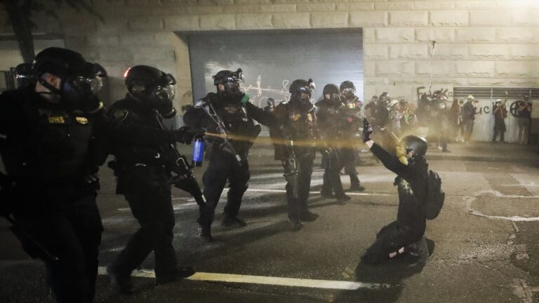 A demonstrator is pepper-sprayed July 30 shortly before being arrested during a Black Lives Matter protest
