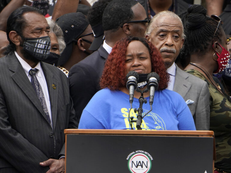 Tamika Palmer spoke at the March on Washington last month at the Lincoln Memorial in Washington, D.C. At left is Rep. Al Green, D-Texas, and at right is Rev. Al Sharpton. (Jacquelyn Martin/AP Photo)