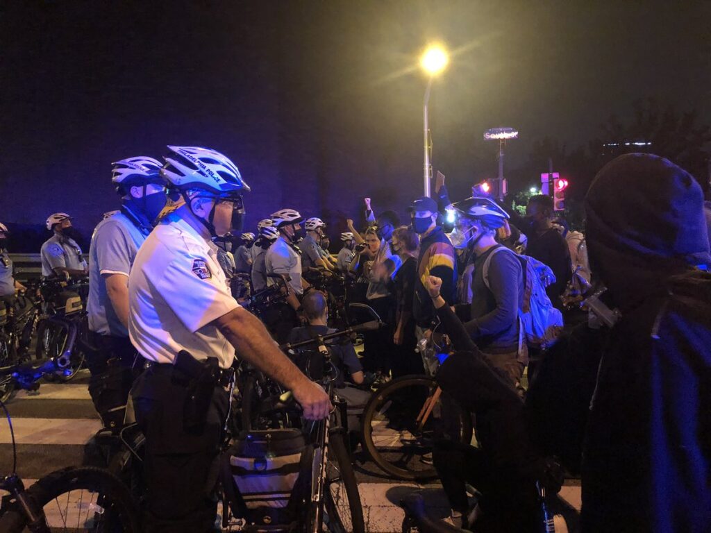 download (1) Protests are stopped at South Street Bridge by Philadelphia Police on the second night of protests after a grand jury's decision in the Breonna Taylor case. (Joe Hernandez/WHYY)