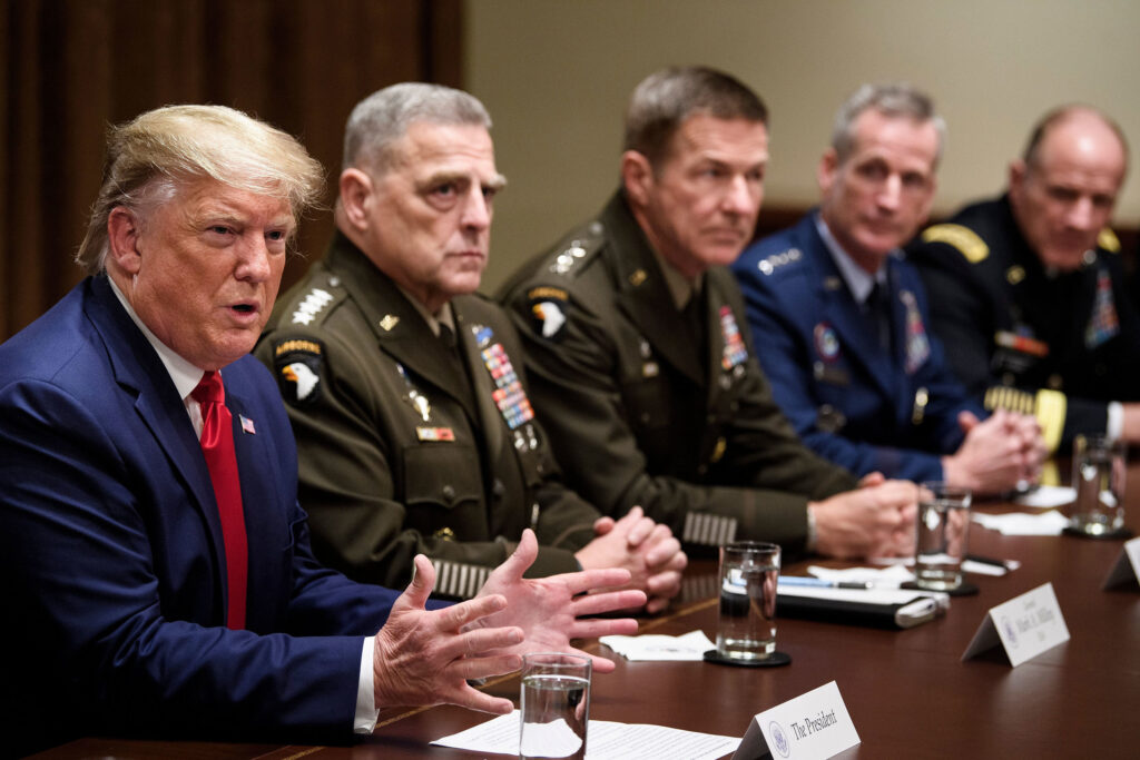 Army Gen. Mark Milley (second from left), chairman of the Joint Chiefs of Staff, and others listen as President Trump speaks during a meeting with senior military leaders in October. Chairman of the Joint Chiefs of Staff Army Gen. Mark A. Milley (second from left) and others listen as President Trump speaks during a meeting with senior military leaders on Oct. 7, 2019. (Brendan Smialowski/AFP via Getty Images)