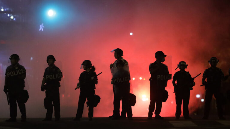 Police hold a perimeter near the White House as demonstrators gather to protest police brutality in the morning hours of May 31, 2020, in Washington, D.C.