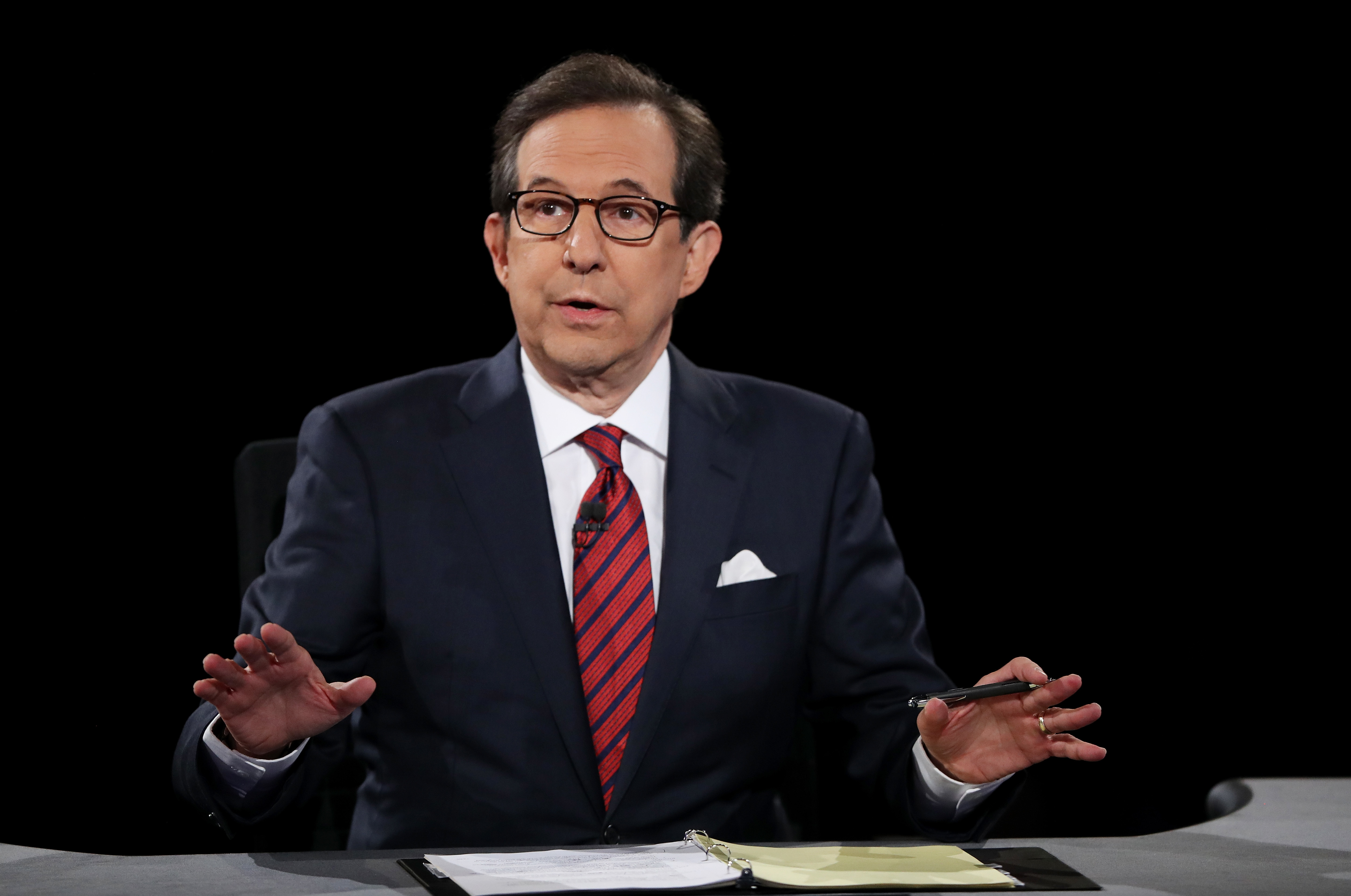 Fox News anchor Chris Wallace, seen here during a presidential debate in 2016, will moderate Tuesday night's debate between Donald Trump and Joe Biden.
