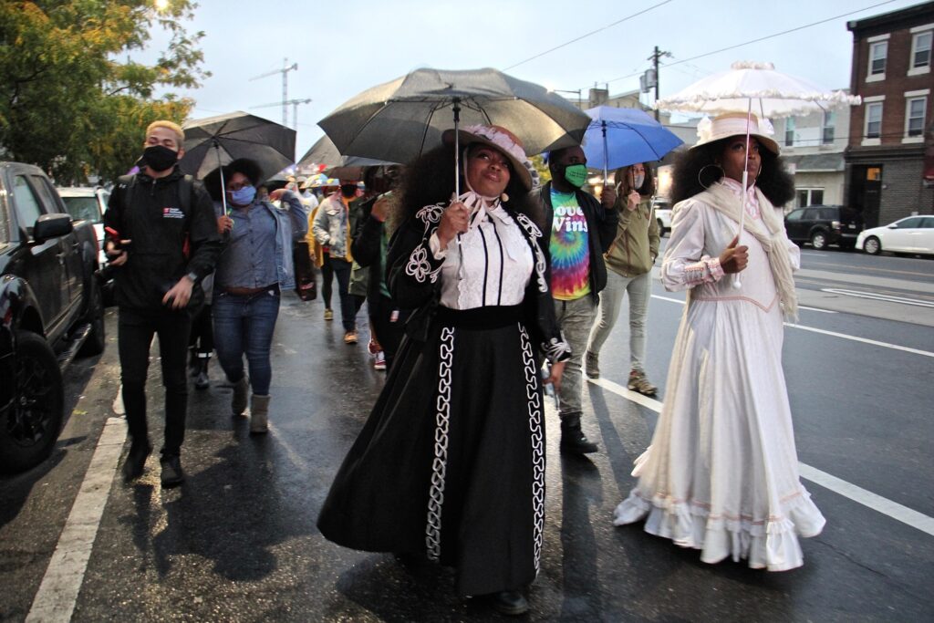 2020 10 12-e lee-jasmaine cook jeannine cook-philadelphia harrietts bookshop-sit in against racism Jeannine Cook (right) owner of Harriett's Bookshop in Fishtown, and her sister Jasmaine Cook, lead a procession on East Girard Avenue