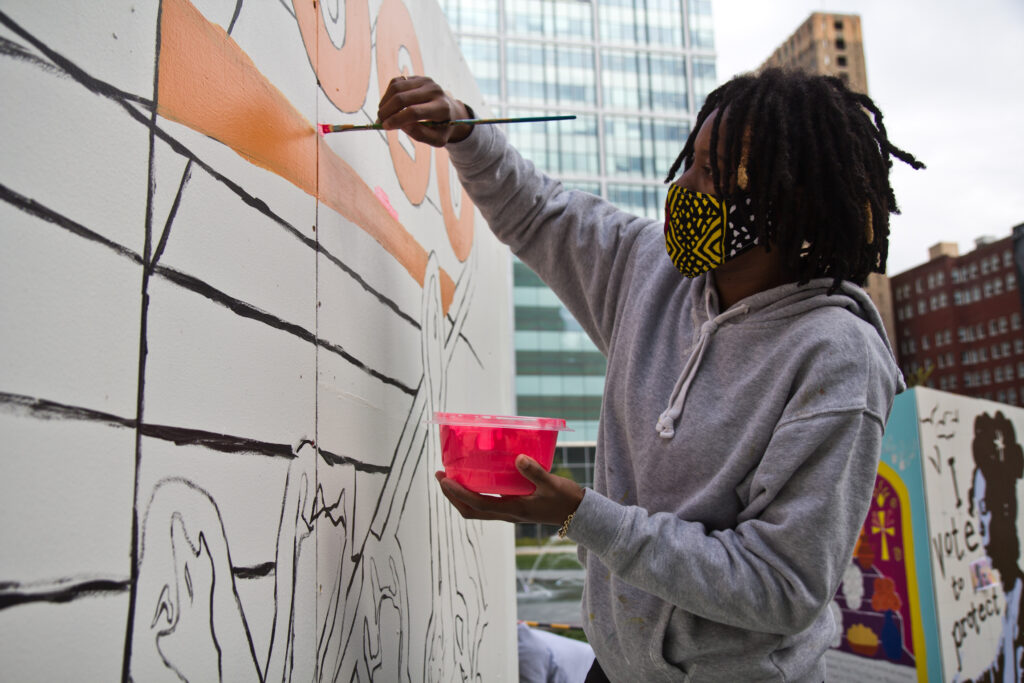 2020 10 6 k paynter vote murals love park-7 D’nae Harrison works on her pop-up