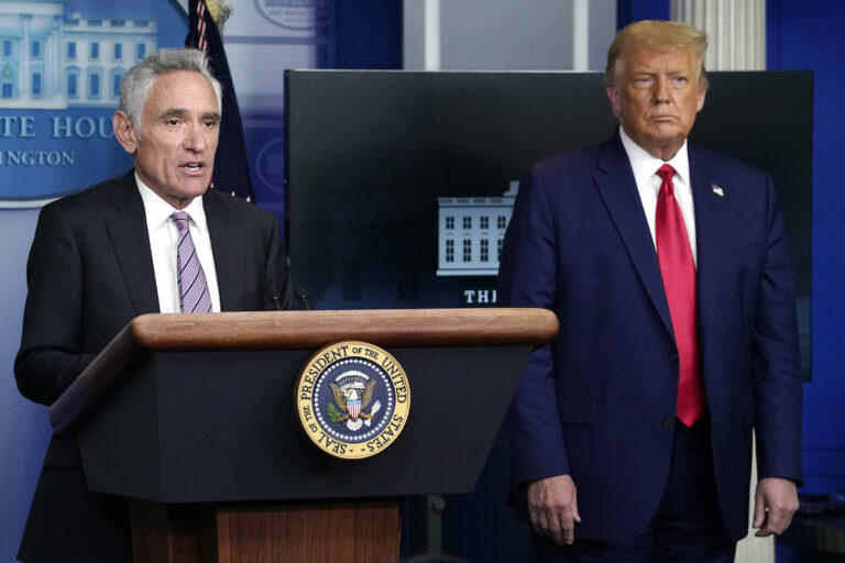 White House coronavirus adviser Dr. Scott Atlas speaks as President Donald Trump listens during a news conference at the White House, Wednesday, Sept. 16, 2020, in Washington. (AP Photo/Evan Vucci)