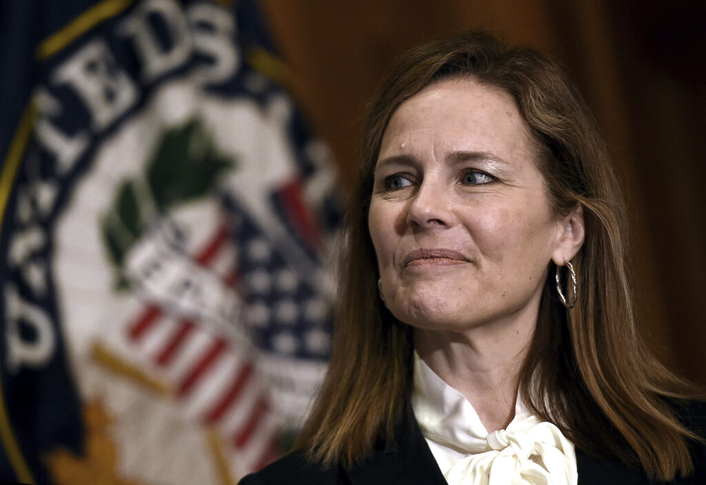 Judge Amy Coney Barrett, President Donald Trumps nominee for the US Supreme Court, looks on during a meeting with Senator Roger Wicker (R-MS) on Capitol Hill in Washington, October, 1, 2020. (Olivier Douliery/Pool via AP)