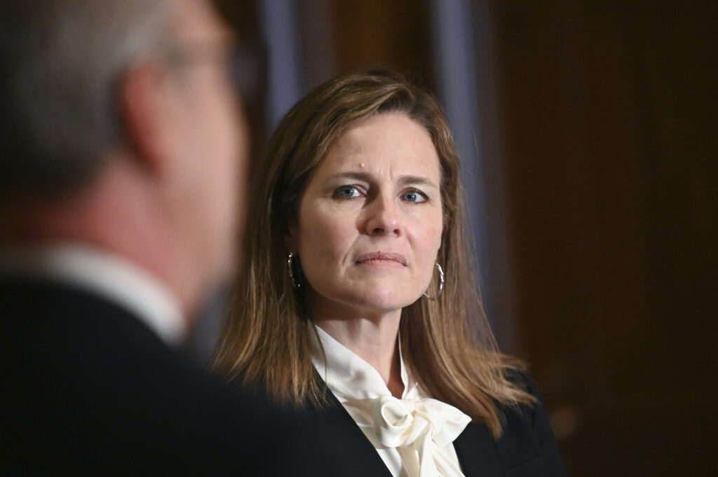 Supreme Court Barrett Judge Amy Coney Barrett, U.S. President Donald Trump's nominee to the Supreme Court, meets with U.S. Senator Kevin Cramer (R-ND) on Capitol Hill in Washington, U.S., October 1, 2020. (Erin Scott/Pool via AP)