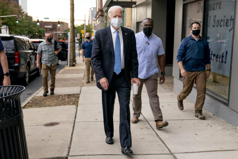 Democratic presidential candidate former Vice President Joe Biden stops to speak to members of the media as he walks out of the Queen Theater in Wilmington, Del., Thursday, Oct. 1, 2020, after pre-taping his speech for the Al Smith dinner. (AP Photo/Andrew Harnik)