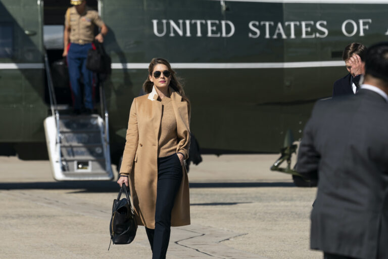 Counselor to the President Hope Hicks walks from Marine One to accompany President Donald Trump aboard Air Force One as he departs Wednesday, Sept. 30, 2020, at Andrews Air Force Base, Md. (AP Photo/Alex Brandon)