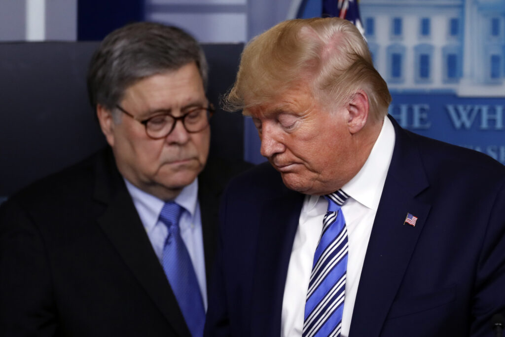 Donald Trump, William Barr FILE - In this March 23, 2020, file photo President Donald Trump moves from the podium to allow Attorney General William Barr to speak about the coronavirus in the James Brady Briefing Room in Washington. The relationship between President Donald Trump and top ally Attorney General William Barr is fraying over the lack of splashy indictments so far in the Justice Department’s investigation into the origins of the Russia probe, according to people familiar with the matter. (AP Photo/Alex Brandon, File)