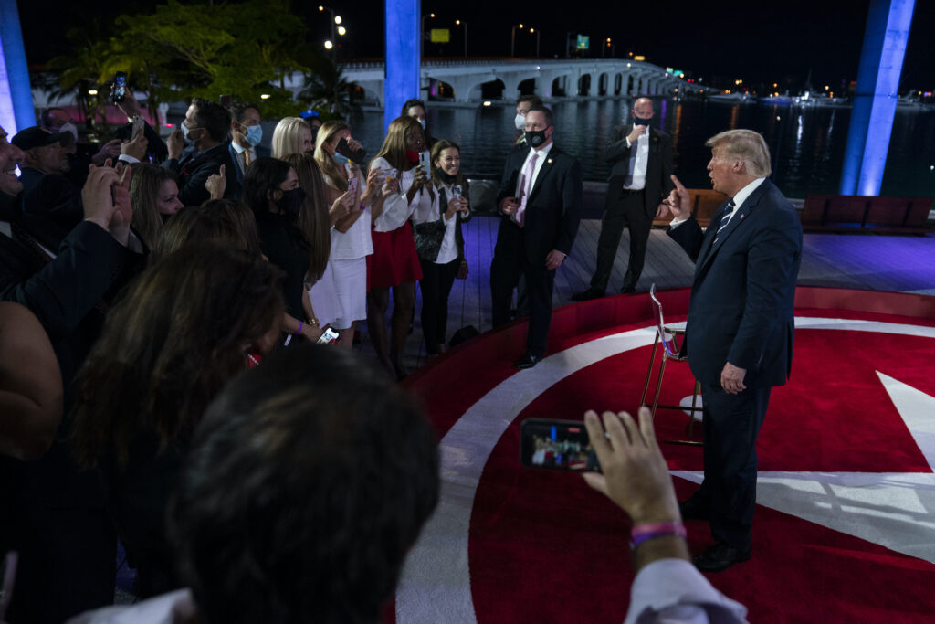 President Donald Trump talks with voters after an NBC News Town Hall, at Perez Art Museum Miami, Thursday, Oct. 15, 2020, in Miami. (AP Photo/Evan Vucci)