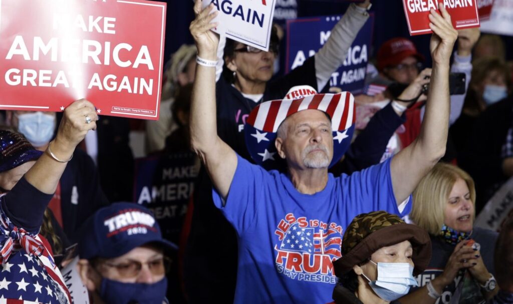 AP20293772117740-e1603223575706-1920×893 A crowd of people wearing Donald Trump gear attends a rally hosted by Vice President Mike Pence in New Cumberland, Pennsylvania.