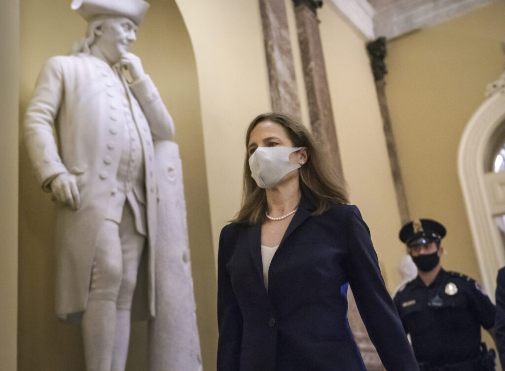 Judge Amy Coney Barrett, President Donald Trump’s nominee for the Supreme Court, arrives for closed meetings with senators, at the Capitol in Washington, Wednesday, Oct. 21, 2020. (AP Photo/J. Scott Applewhite)