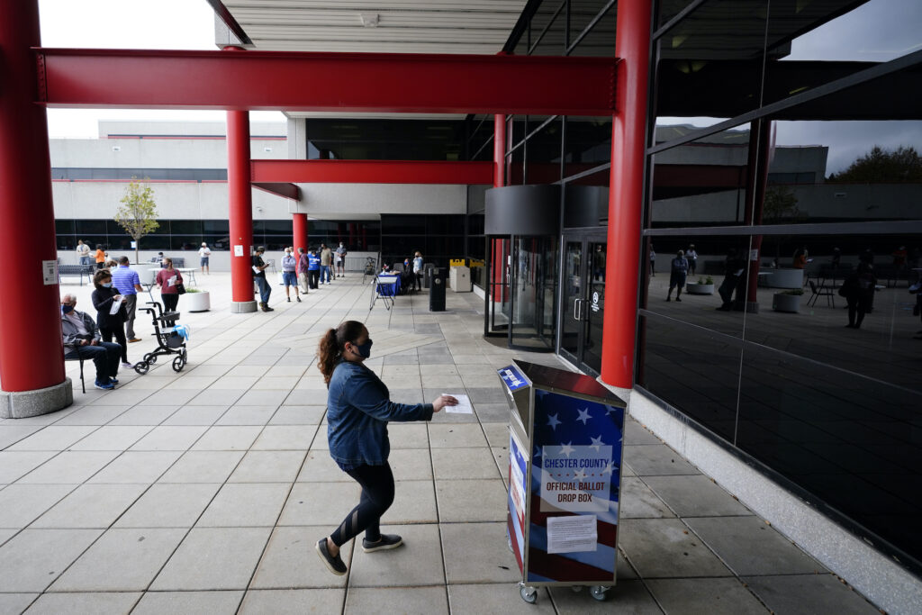 Election 2020 Pennsylvania A woman drops off her ballot for the 2020 General Election outside the Chester County Government Services Center, Friday, Oct. 23, 2020, in West Chester, Pa. (AP Photo/Matt Slocum)