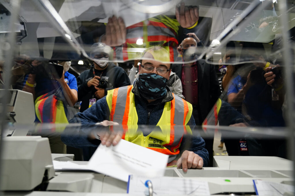 Election 2020 The Day in Photos John Hansberry demonstrates an extraction machine at the city's mail-in ballot sorting and counting center