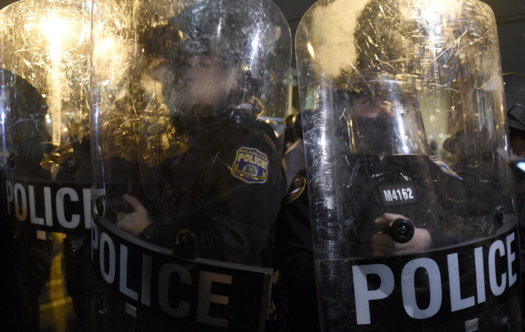 Philadelphia Police Shooting Philadelphia police officers form a line during a demonstration in Philadelphia, late Tuesday, Oct. 27, 2020. (AP Photo/Michael Perez)