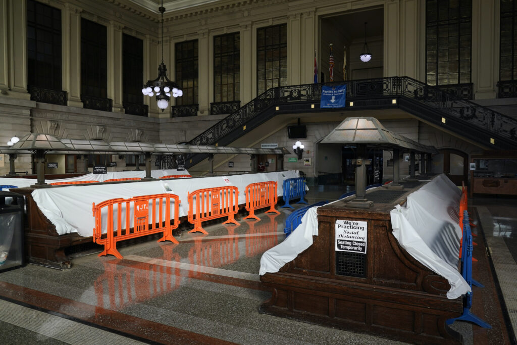 Sandy Anniversary Mass Transit Tarps and fences block the seating area in the Hoboken Terminal waiting room in Hoboken, N.J., Tuesday, Oct. 27, 2020. (AP Photo/Seth Wenig)