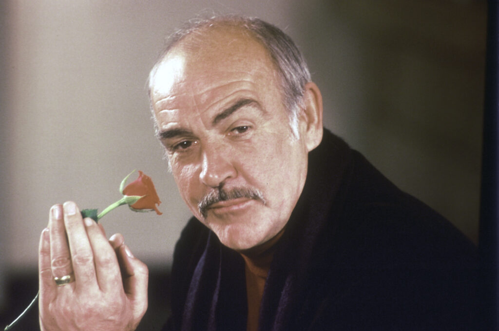 Connery Actor Sean Connery holds a rose in his hand as he talks about his new movie