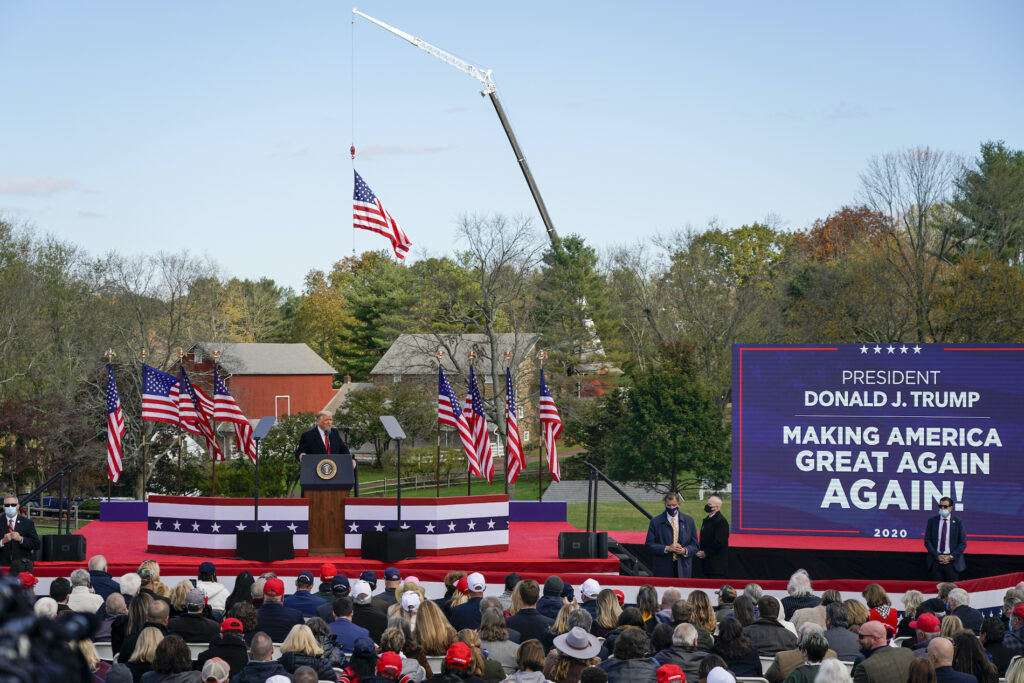 President Donald Trump speaks at a campaign rally at Keith House, Washington's Headquarters, Saturday, Oct. 31, 2020, in Newtown, Pa. (AP Photo/Chris Szagola)