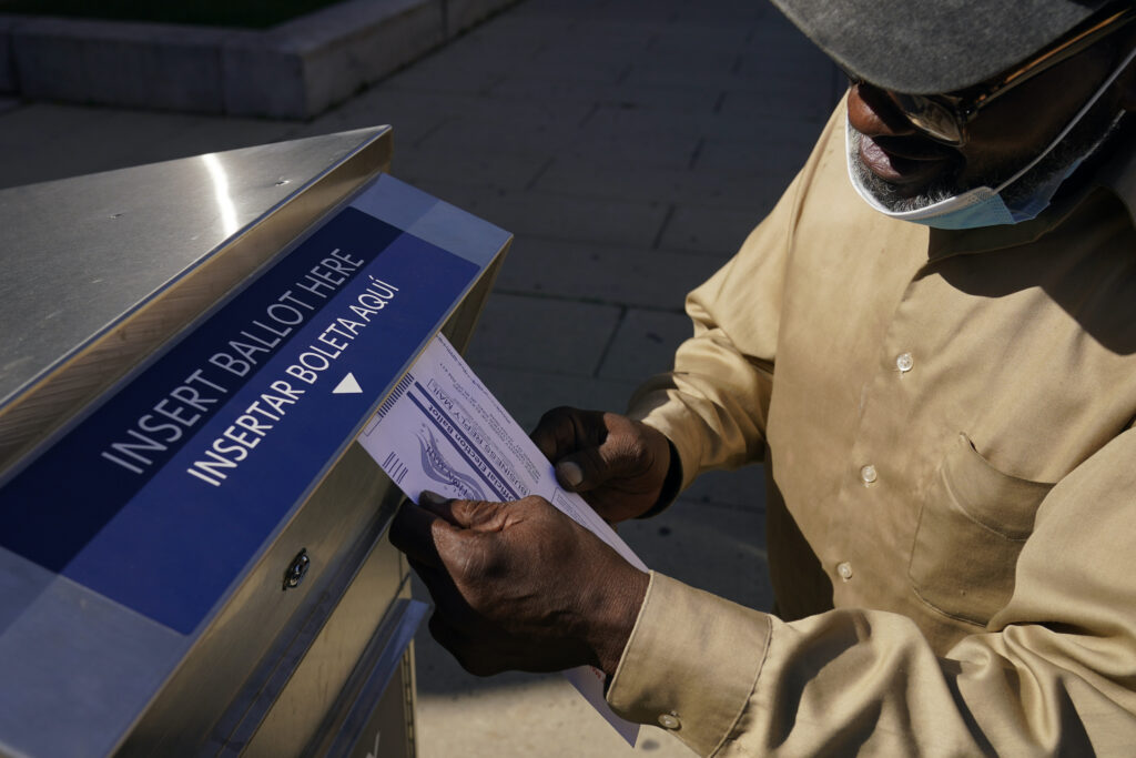 Election 2020 New Jersey Robert Reed deposits his ballot in an election drop box in Newark, N.J.