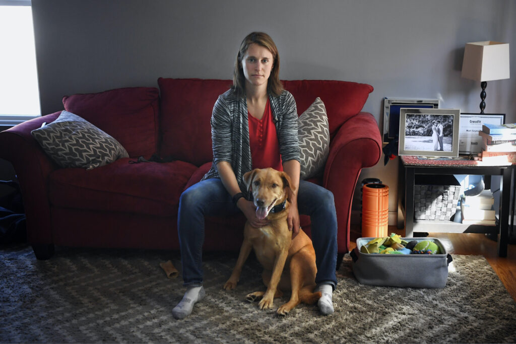Melissa Wilhelm Szymanski sits with her dog Cooper at home in Glastonbury, Conn. Melissa Wilhelm Szymanski sits with her dog Cooper at home in Glastonbury, Conn.