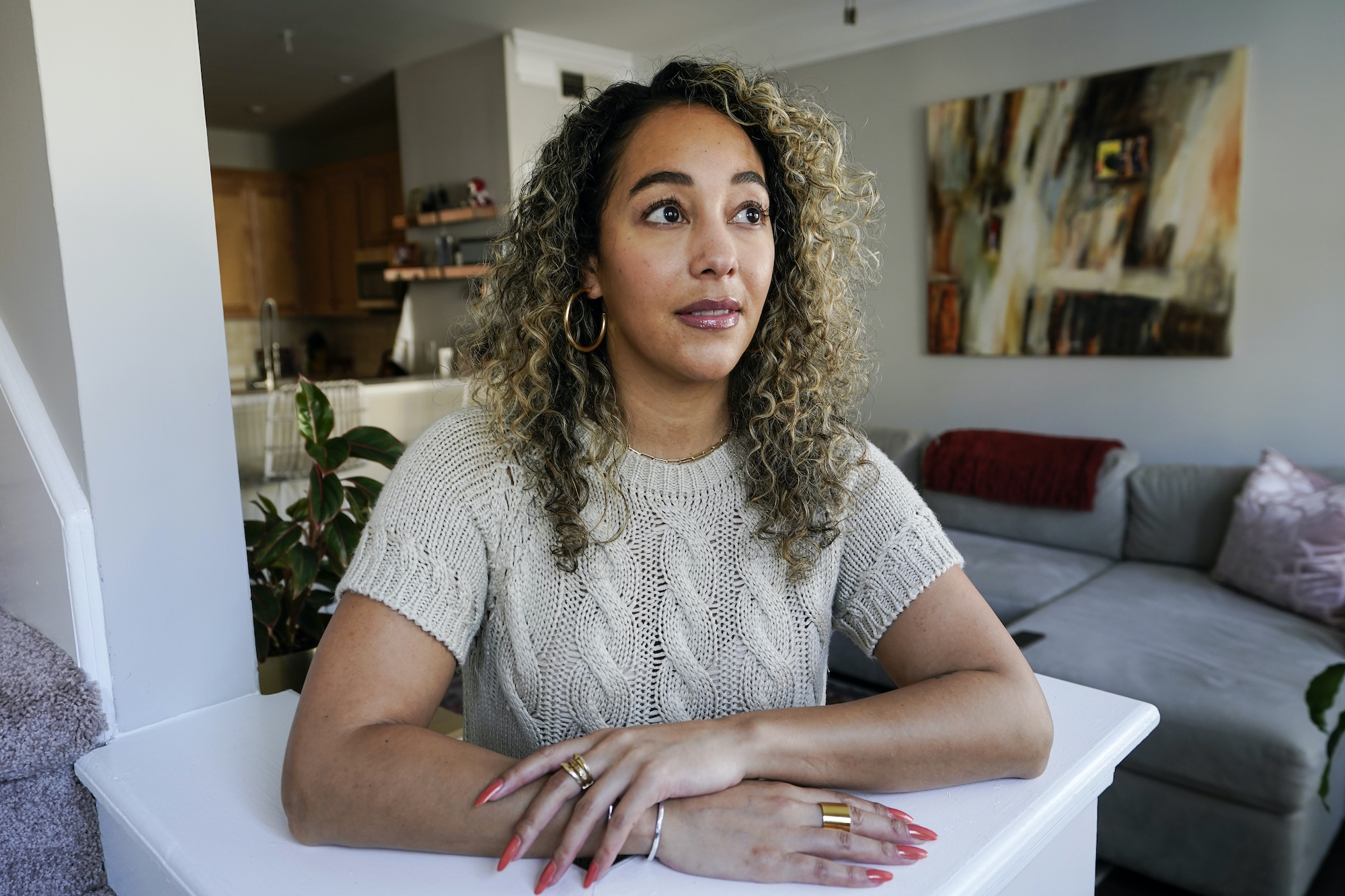 Dani Ayers poses for a portrait in her home in Atlanta