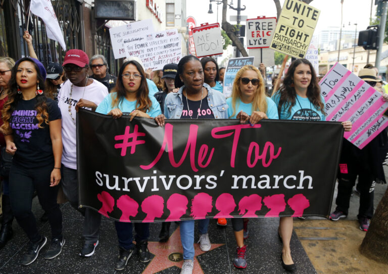 Tarana Burke marches with others at the #MeToo March in the Hollywood section of Los Angeles in 2017