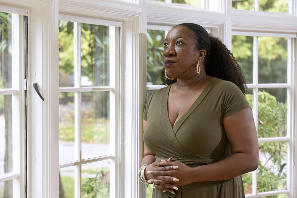Tarana Burke stands in her home in Baltimore