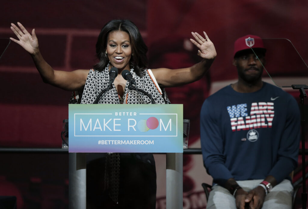 Michelle Obama, LeBron James Former first lady Michelle Obama speaks at the University of Akron as NBA star LeBron James listens