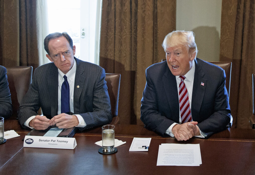 Donald Trump,Rick Crawford,Pat Toomey,Kevin Brady,Bob Casey Sen. Pat Toomey (left) sits beside President Donald Trump during a meeting with lawmakers about trade policy in the Cabinet Room of the White House, Tuesday, Feb. 13, 2018, in Washington. (AP Photo/Evan Vucci)