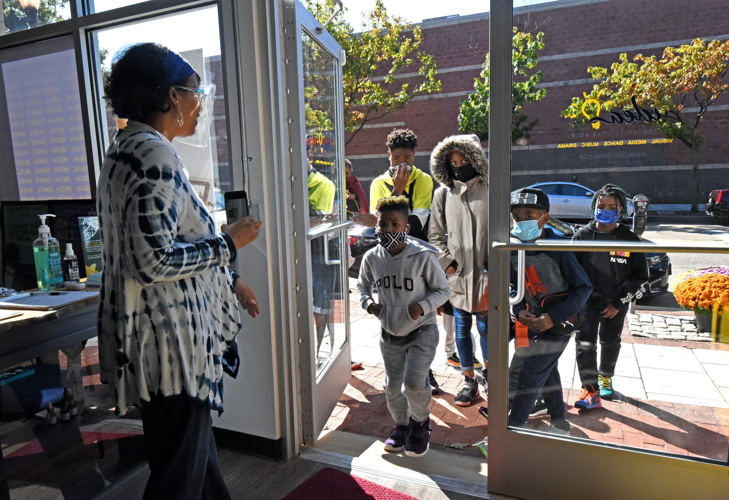 Cynthia Primas greets children for the first day of art and drama classes
