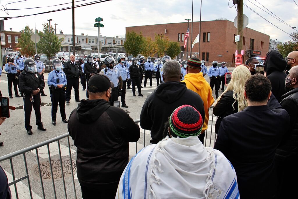 Image from iOS Protesters and police gather after the killing of Walter Wallace. (Emma Lee / WHYY)