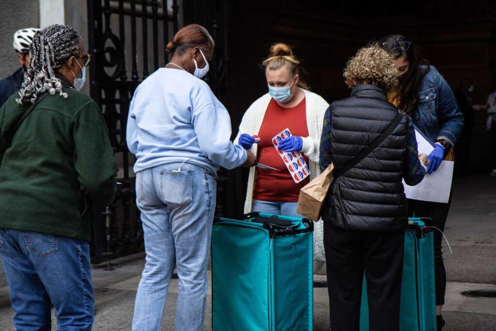 Voters exchange ballots for “I Voted Today” stickers at City Hall in Philadelphia. (Kimberly Paynter/WHYY)