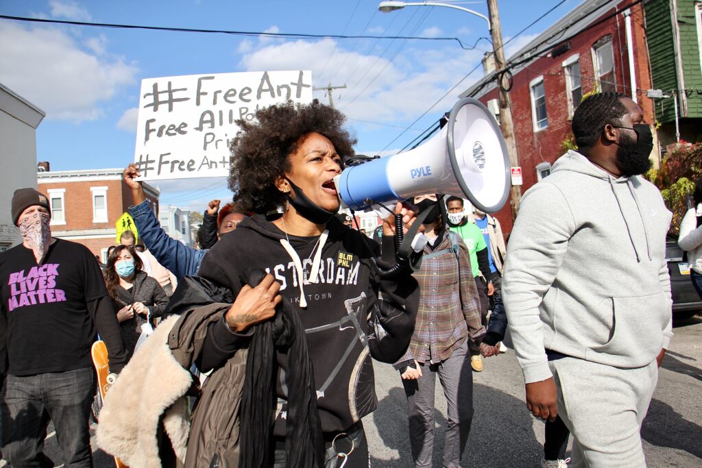 Protesters march from the scene of Walter Wallace Jr.’s killing to Malcolm X Park. (Emma Lee/WHYY)