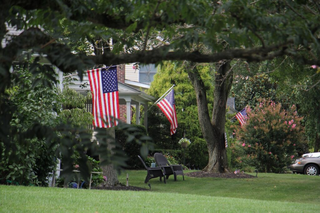 american flag Flags fly from suburban homes in Moorestown, N.J.. (Emma Lee/WHYY)