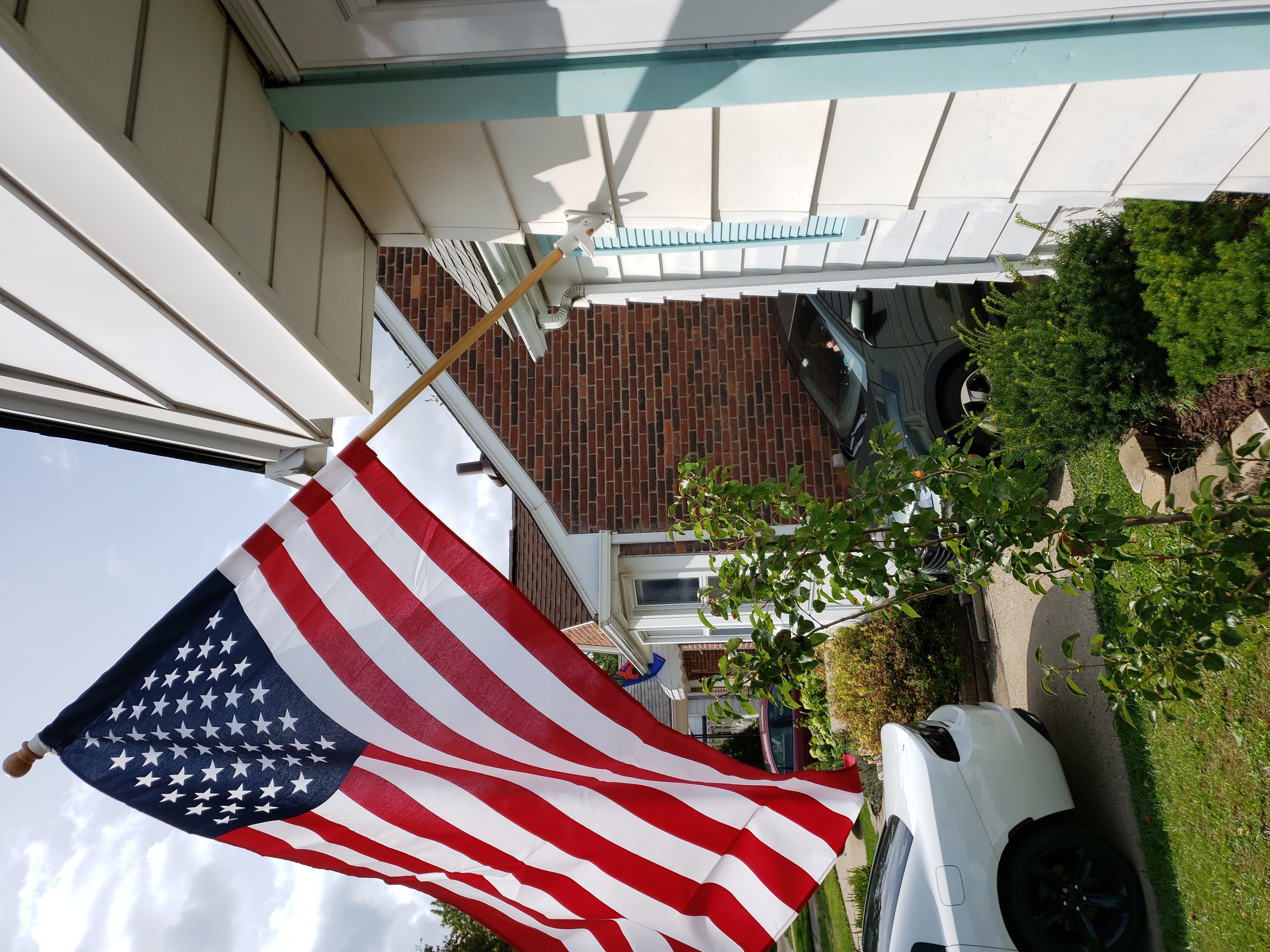 The U.S. flag he flies next to An Vu's garage