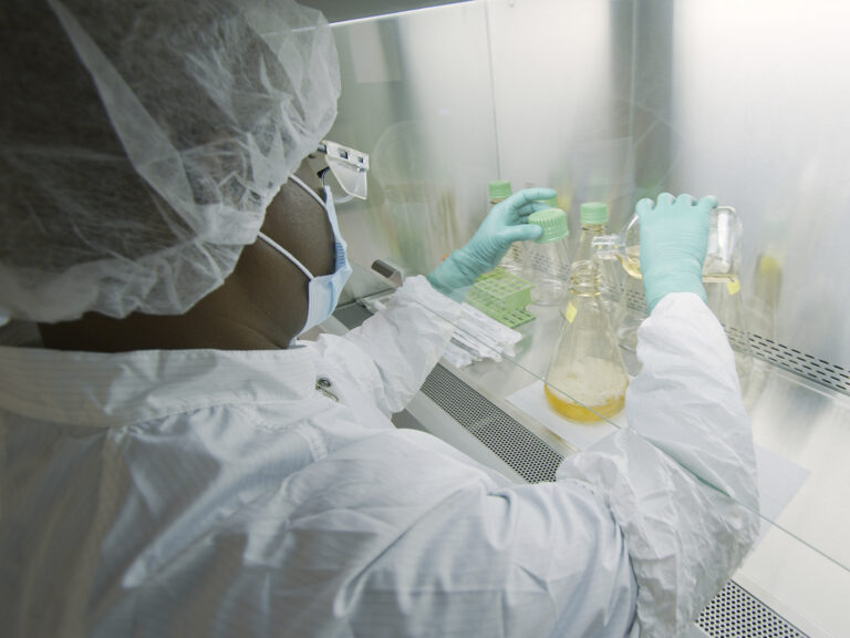 An Eli Lilly researcher tests possible COVID-19 antibodies in a laboratory