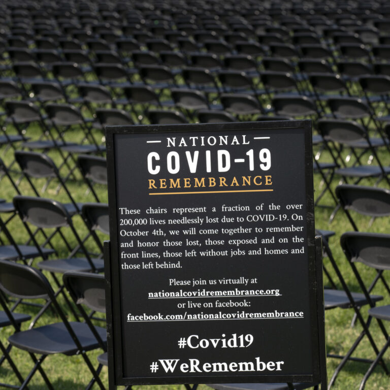 Hundreds of empty chairs who represent a fraction of the more than 200,000 lives lost due the COVID-19 are seen during the National COVID-19 Remembrance, at The Ellipse outside of the White House, Sunday, Oct. 4, 2020, in Washington. (AP Photo/Jose Luis Magana)