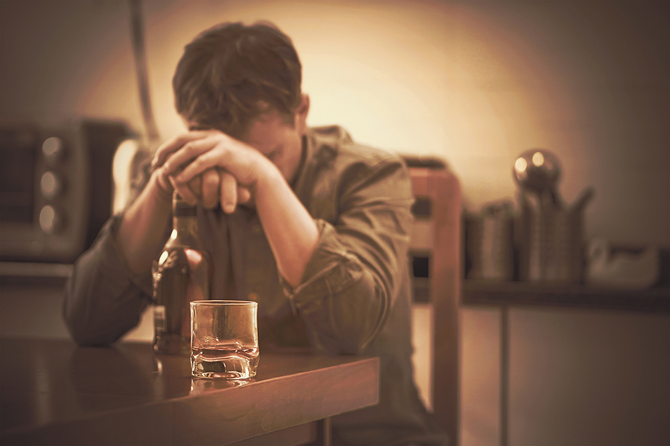 A Man With Bottle Of Whiskey On The Kitchen. The Concept Of Drun (polack/Big Stock)
