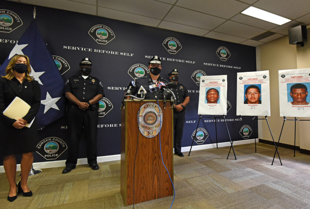 cops1 On October 5, 2020, Camden County Police Chief Joe Wysocki addresses a press conference to announce the arrests of four suspects in the September 15 shooting at the Camden home of two police officers. At left is Camden County Prosecutor Jill Mayer. (April Saul / WHYY)