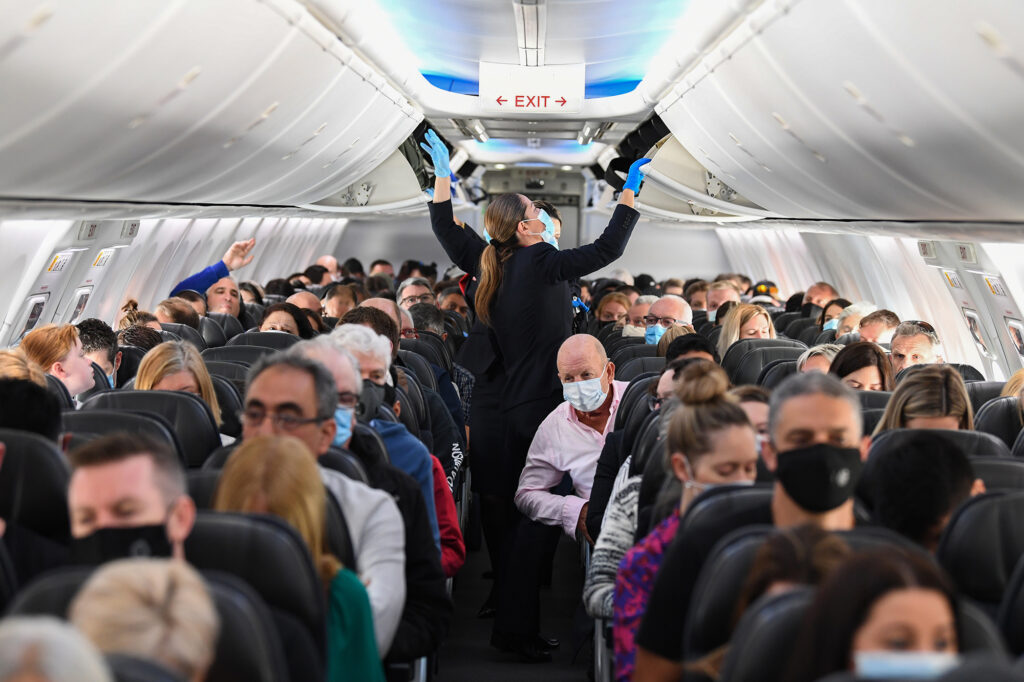 There’s increasing emphasis on wearing masks while flying. How much protection do they offer against COVID-19? A plane full of masked people
