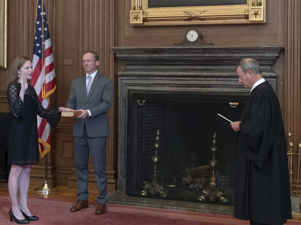 Administration of the Judicial Oath Chief Justice John G. Roberts, Jr., administers the judicial oath to Judge Amy Coney Barrett at the Supreme Court
